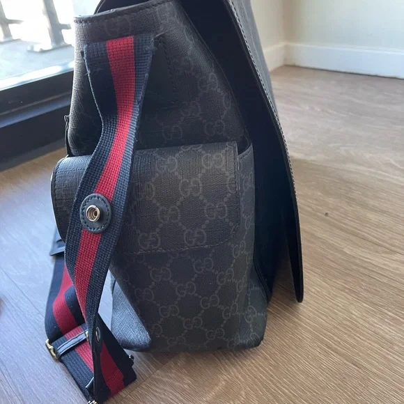 I am selling a Gucci x Supreme Diaper Bag